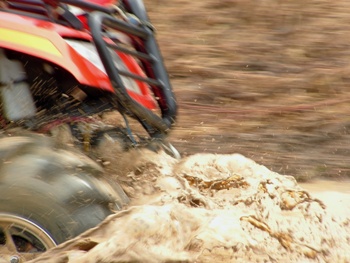 Featured is a photo of an ATV four-wheelin' ... mushin' through the muck, literally! Photo by Brad Harrison from Pierceland, Canada.